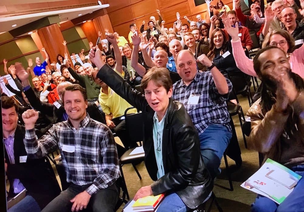 Excited inventors celebrating together at an inventRight event