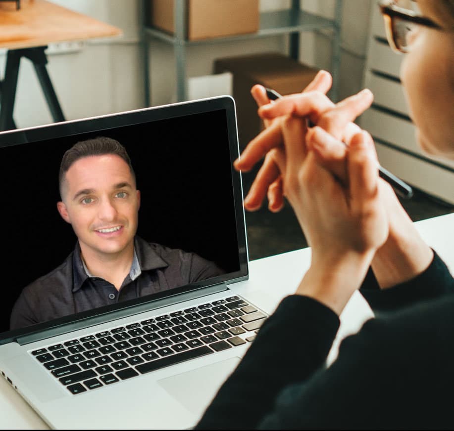 inventRight coaching member working on laptop