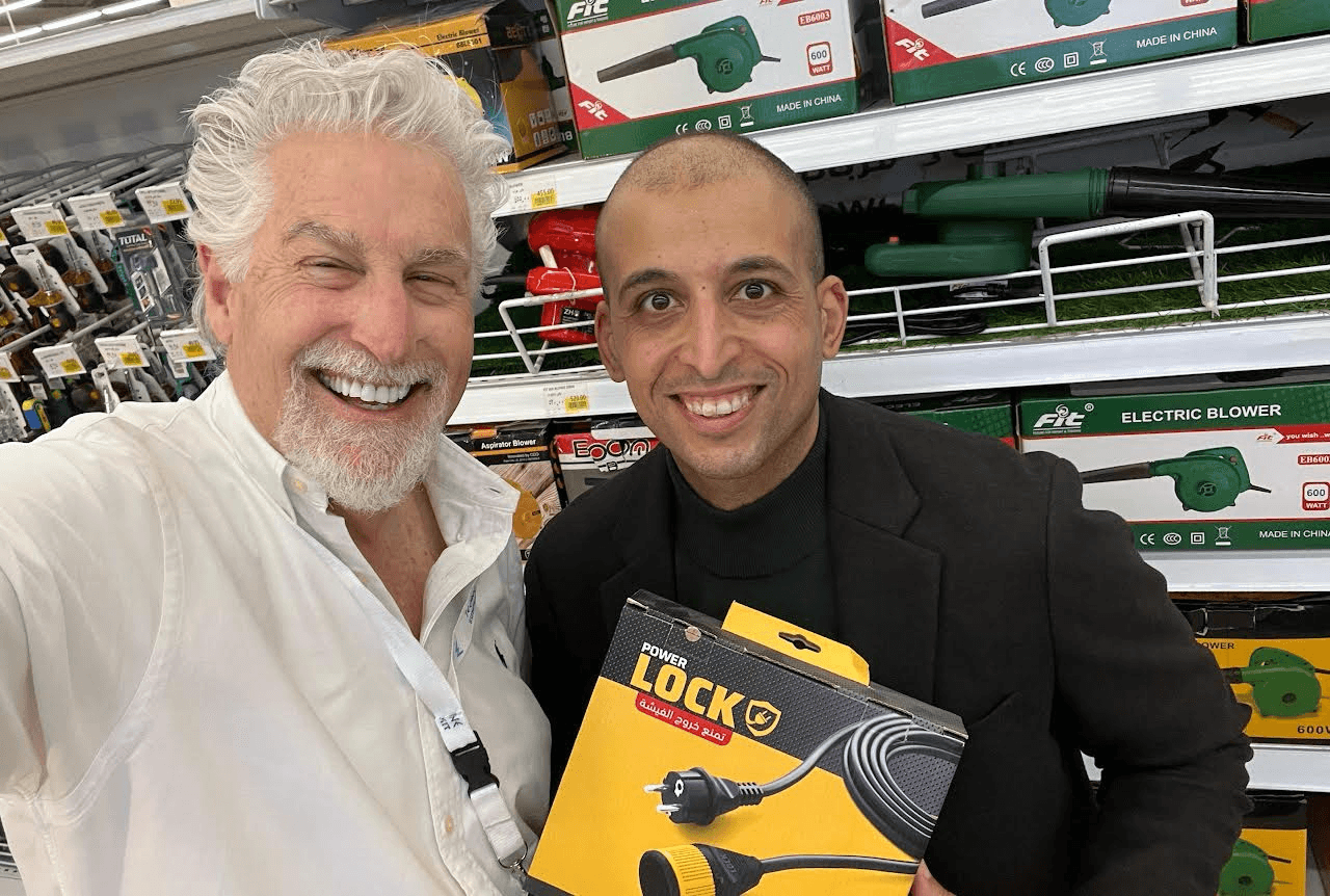 Stephen Key with inventor Mohamed Ali and his Power Lock product in a store